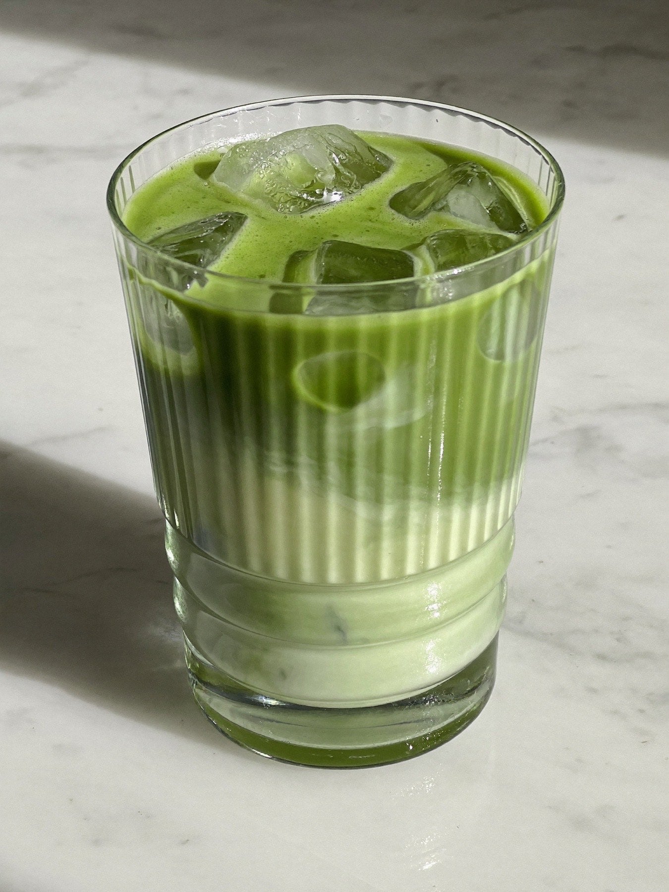 Iced matcha in a tall glass